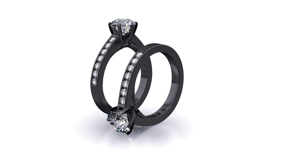 two black gold diamond engagement rings آشنایی با رنگ‌ های مختلف طلا در طراحی جواهرات؛ طلا فقط زرد نیست!